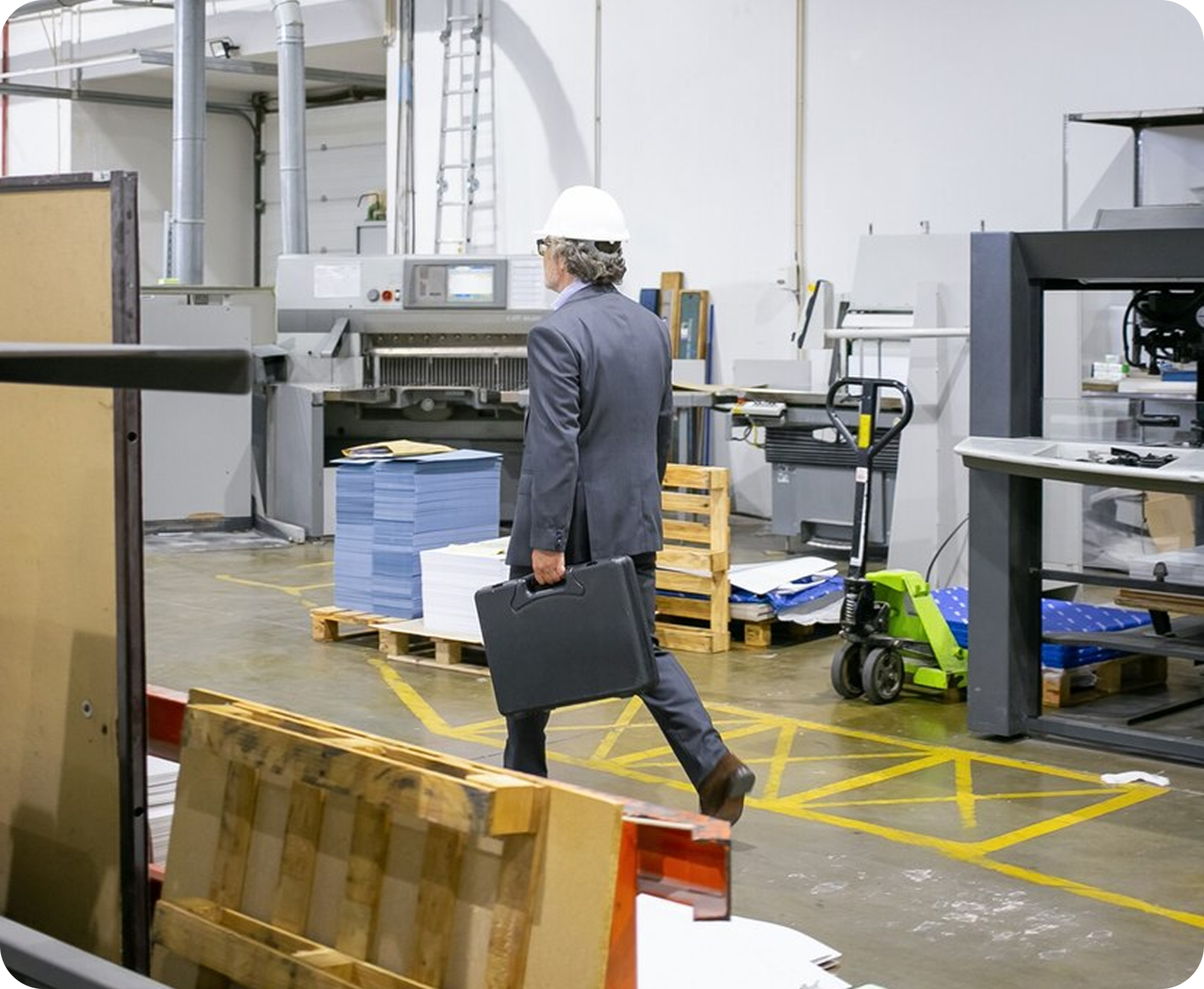 Worker inspecting manufacturing facility—real-world business expertise